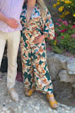 I wore this to a spring Palm Springs wedding and it was perfect! Originally ordered a M but the torso was really short and rode up in the crotch. Returned for a L which was better, but the torso still could have been longer. I had to pin the legs up inside since I didn't have time to have it tailored, but it was still amazing! - Shannon D.