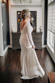 We had a small micro wedding in November, I knew I wanted a classic look but couldn't find one anywhere. I stumbled upon this STUNNING dress and knew I had to at least try it. I ordered 2 sizes (I used the sizing chart and I was in-between a M /L so I ordered both. The medium fit like a glove. For the price I wasn't expecting the material to be good quality but i was wrong. I was a nice thick/quality material and SO comfortable. I had so many compliments on this dress and people thought it was a designer dress. I can't recommend this dress enough. You will NOT be disappointed in this beautiful classic. - Keltie H.