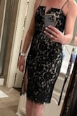 Loved this dress and it fit like a glove. It does not have much give so be certain of your size. I could have probably used the M but might have taken it in. I am also small in the chest and it was still tight. Be careful of what you eat prior to wearing this dress as it is not very forgiving but it is beautiful and you will get many compliments! - Kari B.