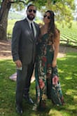 The material is satin-y, and the skirt is surprisingly heavy weight in a "good quality" way. I wore it to an outdoor wedding in 80-degree weather and it was perfect. The green color is a touch darker in person vs the photo. - Stephanie T.