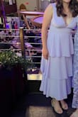 This dress was perfect for the late spring wedding I just attended. The lavender color was amazing and I loved the flowiness of the shirt. The top is fairly low and I had some trouble with garment tape, so I ended up just not using tape. As long as you don't mind the low cut, it's very flattering. The rib cage is pretty snug - but I wouldn't have wanted to go up in size since the rest fit very well. I ordered medium, which I always order so I was happy with it. - Allison K.
