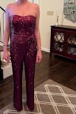 This was initially purchased to wear to a black tie event, the Red Ribbon Gala, w attire theme "Red Carpet Disco chic."

I loved this on the site and tried to make it work in sm and med. The sm fit a bit too tight in the bust and a tiny bit in the torso (have a straight figure from my rib cage down. No vivacious curves of any kind. Even w squats & lunges, I have a sad flat rump.) The med was slightly too lg in the bust and I was afraid of slippage. That may be because I don't wear strapless rompers/dresses as low down on my chest as the models do. The sequin sewing on the bodice was also askew.
I even purchased 2 meds hoping one was initially just cut a bit "off" since it wasn't even symmetrical when on a hanger. The 2nd was symmetrical but still not my fav.

I wished one of these would have been perfect for the occasion, The cut/fit was less flattering then I had hoped; coupled with the fact that in person, it didn't present as fancy as the online images portrayed the jumpsuit, made this it a no for me. - Molly M.