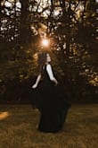 When I bought this dress, I was a bit worried because of the front low cut. But, it turns out to be beautiful. The dress has a great texture if you went to create that movement/ flow in your photo! You won't regret it! - Barbara H.
