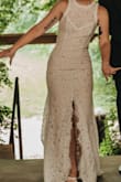 This dress was beautiful! I used it as my reception dress for my wedding. It was lightweight and stretchy, perfect for eating tacos and dancing. The XS was good but it would have been perfect if I could get an XXS. I have a pretty small ribcage so I had to get it taken in on the sides and around the neck but my tailor had no issues. I also had her put in a bustle and I forgot to unbustle it so I didn't get any pics of the train but it was beautiful! The only thing I thought was strange is that the slit goes right up the middle? But it ended up letting in a nice breeze while I was dancing. It was a very nice dress for the price and I'm glad I got it! - Marna M.