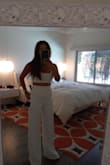 Very cute ensemble. Cute for dressing up for a night out or lunch with girls. I ended up ordering magenta and white and returned the white even though I liked it a lot too. I knew the pants would need hemming. The top, I wish I could have ordered a large top and small pants but that's the way it goes so it's ultra sexy on top if you are big breasted. A Medium would have too big on the pants, as the pants fit perfect other than length. - Parvaneh P.