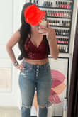 I did not have the same problem getting this in that other people had. It has a zipper, so it was pretty easy. I was concerned the sequins would feel uncomfortable on my arms, but it was pretty smooth! Wore this to the Taylor swift concert. - Geraldine M.
