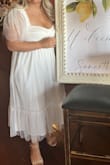 The overall fit of the dress was perfect! The only thing about the top is the cups are small so anyone with big boobs, it looks a little odd on top. I was able to wear without a bra and it looked better than with a bra. Loved the color, pattern, length and style though! Bought for my bridal shower and may wear again for my rehearsal dinner! - Samantha C.