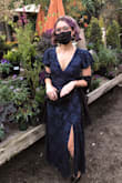 I wore this to a friends fall wedding and loved it! It fit like a glove. It is low cut so I wore adhesive bra cups and it worked perfectly. I'm 5'4 and the dress was a perfect length with 3 inch heels. - Taylor H.
