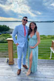 I'm 5 months pregnant and I ordered the small and medium just in case. Small is my usual pre-pregnancy size and fit perfectly, no need to size up, and plenty of room for my bump. Still felt sexy with the slit, which was nice. Got lots of compliments! - Kasey H.