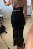 Love this set so much but it didn't fit me right! I'm a 32 double or triple-D and the top felt a little loose and offered no support. The skirt's elastic didn't cause bulging but it felt super tight and uncomfortable around my waist. It's like I need one size smaller in the top and one size larger in the bottom. If they were sold separately I'd definitely repurchase! Like others said, the fabric is nice and stretchy but does leave little black pieces of lint everywhere. I didn't find the fabric to be especially hot or heavy, which is a plus. - Georgia K.