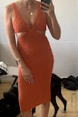 Gorgeous dress and love that it's lined! It's a heavier material but not too hot. That being said, this didn't work on my body which is pretty straight up-and-down and busty. The S squished my chest flat and cut into my sides (you may not see this in my pic because it's very posed). I also ordered an M and that was too loose in the bust area and didn't look good either. Overall, I think this would be most flattering on a true pear or hourglass shape. I carry weight in my middle so it is doable but definitely not the most flattering. - Georgia K.