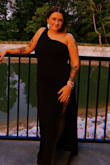 I loved this dress for the formal wedding I was in. The slit is high but it fit great and wasn't restricting anywhere! - Kori C.