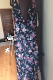 This dress is just stunning. The tiers in the skirt and the ruffle on the strap are my favorite things about it. Gives a gorgeous flamenco dancer feel. Plus there's a black slip underneath so it's not see-through at all but with a cute slit up the leg. Definitely fits true to size and is super flattering in the waist and not too tight in the hips/butt. If you're a bigger busted girl or a breastfeeding mom like me, just know it doesn't provide much support for the girls on its own, but add sticky boobs and you're golden. I'm wearing this to my friend's San Diego wedding in the fall and can't wait!! - Maria L.