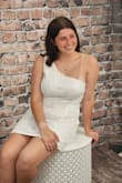 I purchased this for my daughter's senior portraits. It runs about 1-2 sizes small. She's typically a small/medium but this medium was almost uncomfortably tight for her. If I had the time I would have exchanged it out for a larger size. She loves the dress but I'm upset that I paid so much for a 1 time wear dress due to the sizing. - Brandy W.