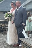 This beautiful dress was perfect for my outdoor wedding in the ruins of an old church. I originally purchased a 1X which would be my usual size even though other reviews said to size up and returned it for a 3X which fit well both in the chest and to give some extra length. At 5'10" the hem was just touching the ground with flats on. - Kelly B.