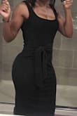 The material is stretchy and soft. This dress is sexy and can be dressed up with heels or down with sandals or tennis shoes. I'm going to purchase the taupe color as well. - Shieta M.