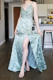I bought this as a bridesmaid dress and it's gorgeous! I used the size finding tool and it helped set me up with the right size, which I appreciate a lot. I'm not a very tall person, so the dress is super long on me, but the fabric is beautiful and the dress has a gorgeous lining. It's got a beautiful shimmer to it. - Althea A.