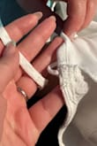 When I opened the package it was broken. Straps were not attached to close the wrap. The white is also super see-through even with the liner it already has. - Hannah S.