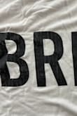 I washed this item before wearing it and the lettering immediately cracked, so I had to throw it out. The shirt is super soft, but the quality of the letters is very poor :( - Danika M.