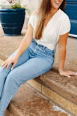 this worked out great with jeans as one of my senior picture outfits. i wanted the waistband part to fit snugly so I sized  down to an xs (usually in between xs/s), but if you want a somewhat loose fit as pictured on the model, go with your usual size! this was very soft and the front fabric did not fall open for me. a loose, airy vibe up top and i love how it comes together at the waist. so flattering! - Ashlyn M.