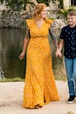 A little snug on the bust and slightly on the waist but it worked for the occasion. Length was perfect and neckline was modest without showing a ton of cleavage. Pricey but worth it. - Calli C.