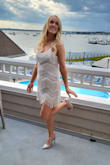 It was beautiful on. I wore this for my bachelorette. I washed it according to the care label and all the fringing frayed really badly, it was not salvageable. - Lorna C.
