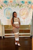 I wore this for my gender reveal and it worked out perfectly! I did order both the small and medium because I was worried about my belly but the small fit me better. I thought the material would be too thick for summer but it served as a good summer dress. Would recommend! - Amber E.