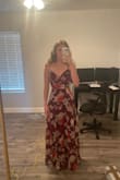 I originally bought this about 3 years ago for a wedding in Fiji, but due to Covid we couldn't go and it was a little too small as I was more muscular in my rib cage area then. However, now, it fits perfectly and looks flattering on me. It is a bit long but with heels it barely drags. - Sarah L.