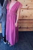 The dress was perfect! I got so many compliments the whole night. I ordered a medium but I probably could've also fit in the small. There's a tie in the back but it doesn't adjust the front. It was a little loose around the chest and shoulders but I used tape to hold it on. - Ashton A.