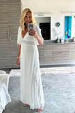 I wore the Sweeten the Occasion White Lace Short Sleeve maxi dress to a birthday party. The fit was perfect and the styling was lovely with a hint of sexiness. The material was lightweight yet sturdy with a double layer. I felt like I was floating in the dress when I walked. The compliments I received on this stunning dress were plentiful and the photos online do not portray how gorgeous it truly is. This was my first Lulus purchase and it certainly won't be my last. - Tina C.