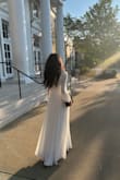 I purchased this dress for my daughter to wear at her high school graduation. She was looking for something flowy, elegant, and modest. This fulfilled all of her requirements and she looked absolutely stunning in it. The material is high quality and it falls beautifully. In terms of size, it was a true XS. She received so many compliments! - Basma B.