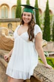 Really pretty dress! It is very low cut in the front - was constantly adjusting for my Grad pic shoot. Also was pretty short for my 5'10" self - I only wore this for pics! Had to wear a different one to the Grad party. - Joelle M.