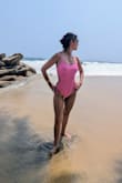 Beautiful one piece swimsuit.  I got a size M since I have a 62" torso but I could still fit in a size small.  It's very flattering and fits great.  I also got this in pink. - Teresa G.