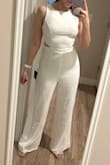 This is such a cute piece! It fits true to size, but you'll need little adjustments depending on how tall you are. I'm 5'1 and I had to cut a little in the legs and shoulder stripes (super easy to fix). I'm in love with this jumpsuit! - Tais D.