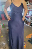 Loved the dress and the color is pretty. The material wasn't thick like I thought silk would be. True to size and fits perfectly. The only thing I did not like was that the back of the dress where the bottom of the zipper sits points out...not sure if that's because of my body shape or just the dress in general - Savannah D.