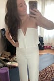 I was absolutely enamored with this jumpsuit! I bought it for my rehearsal dinner. As other reviews said, the length is a bit long, so I got it hemmed but the midsection fit like a glove. Unfortunately, the zipper was giving us difficulty (it has plenty of stretch and room to spare, but it doesn't like to zip over the seams). It seemed to be all right until I went to the bathroom right before my rehearsal for my wedding started and the zipper split when we zipped it back up. We had to safety pin it up. 

I was so bummed and I can't get the zipper to work ever since. I was so thrilled to wear this and wear it again on my honeymoon but I would have to get the zipper replaced for sure. - Alexa D.