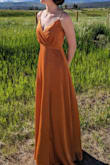 Dress is beautiful - love the color and has a nice somewhat metallic sheen to it that makes it look more expensive than it is. Only things to note - it is a long dress so if you are shorter, you'll definitely need to get it hemmed (the dress was barely off of the floor even while in my heels) and the waist could be more fitted - all things that can easily be fixed with the help of a tailor, though certainly wearable without the alterations as I did! Also curious how long the dress will last as the material seems a bit fragile and, as stated, the dress is long, so the close floor contact is already starting to fray the bottom a bit, though not super noticeable unless someone is very closely looking at your feet. - Lauren P.
