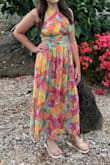This dress is stunning. The top is like two long scarfs that need to be tied. The top is see through and does not offer any support, so a sticky bra must be worn. - Courtney E.