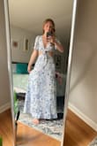 This dress is so beautiful- the fabric is soft and does not wrinkle easily. It fits like a glove! It is light weight- but heavy enough where it will not blow away if it's windy and does not show any under garments. I wish the dress had more colors because I would buy more if I could! - Emily C.