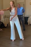 I wore this for my rehearsal dinner and received so many compliments! The top and bottoms fit perfectly. The only thing I had to change was the length of the pants- I had to get the pants hemmed. The fabric was comfortable and breathable, and not see-through. I did make sure to wear nude undergarments and I made it through the night without getting a drop of anything on the all white fabric! I would buy this again in a different color! - Emily C.