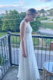 Got this for my elopement/microwedding in July. We will be outside at sunset at a lake and this dress fits that vibe. Make sure the back is sewn where the straps are on either side of the zipper and not under your armpit before cutting tags off 
It's really pretty and just needs some boob-cup support. Slit isn't that high. - Rebecca L.