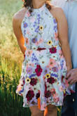 Love the colors and texture details of the flowers. Beautiful open back. Buttons around the neck x 2 I needed assistance by someone else but overall loved this dress - Emily H.