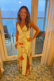 I absolutely loved wearing this dress! The fabric just made me feel glamorous and pretty. I wore it to dinner on a cruise with my family and can't wait to wear it again. I am pretty short, so I had to have it altered for quite a bit of money because of the fabric and lining, but it was worth every penny. The rest of the dress fit perfectly. - Angela B.