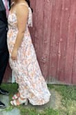 I wore this for a summer wedding and it was perfect. I got so many compliments on it and it was super comfy. I'm about 5'5 and the length was perfect. Long enough that I could wear heels with it, but I wasn't tripping on it when I took my heels off to dance. - Hannah M.