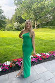 I loved this dress so much when I saw it and the green is so stunning. I wore it to a wedding and received plenty of compliments. The material is good quality and fairly thick but I was not too hot in it on a summer day. Overall highly recommend this for any wedding or event. - Sydney C.