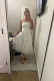 It's perfect for any bride-to-be!! I got a small because I was afraid the straps were going to be too big and it's perfect! I'm usually a size M. Does not stretch at the bottom, on the top it does a little! - Maddie N.