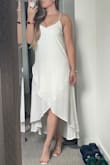 It's so beautiful. I'm considering buying in other colors. Somehow it's loose, yet actually gives you a shape. It doesn't just hang on my body. It's fantastic. Good material and not see through. - Megan P.