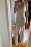 I was obsessed with the train & back, but not with the high neckline. Easy fix for the seamstress and I love it even more! Got it tailored to fit my shape better too but probably would've looked fine without it. The slit up the middle was a little awkward & had to adjust it a few times during the day.  Excellent price for an elopement dress and the material was nicer/softer than I was expecting. - Kerri M.