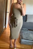 Amazing material it's like ribbed velvet but not in an aggressive way it's soooo soft and stretchy but not too thick. The color is more olive green - McChrista B.