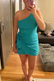No stretch but medium fit me well. The shoulder strap is slightly loose but it's fine - McChrista B.